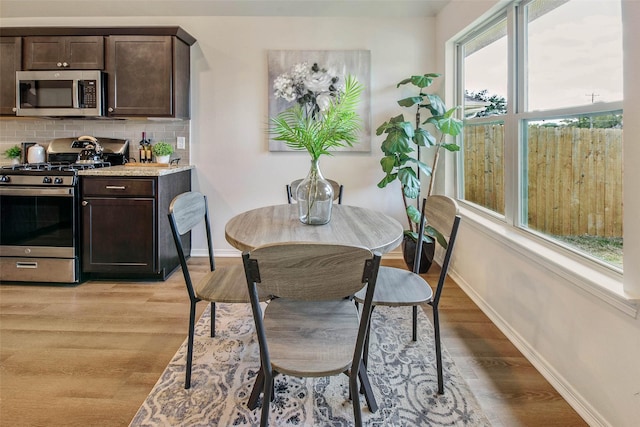 dining space featuring light hardwood / wood-style flooring