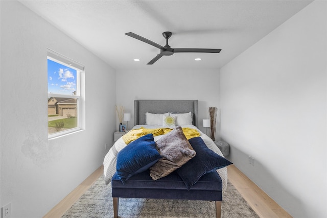 bedroom with ceiling fan and hardwood / wood-style floors