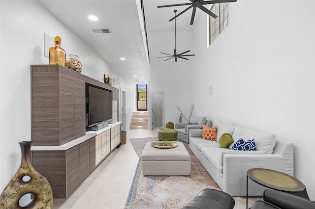 tiled living room featuring ceiling fan