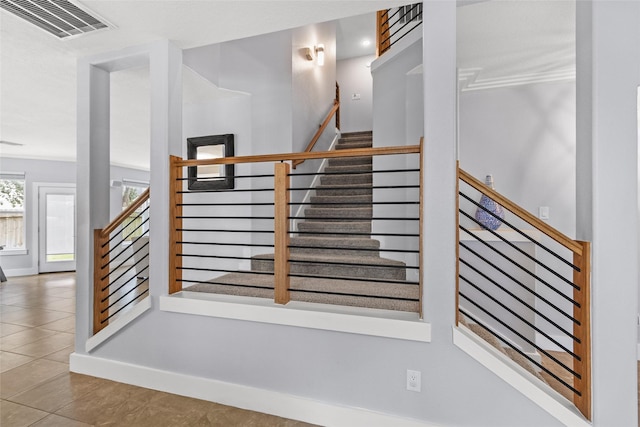 staircase with tile patterned floors