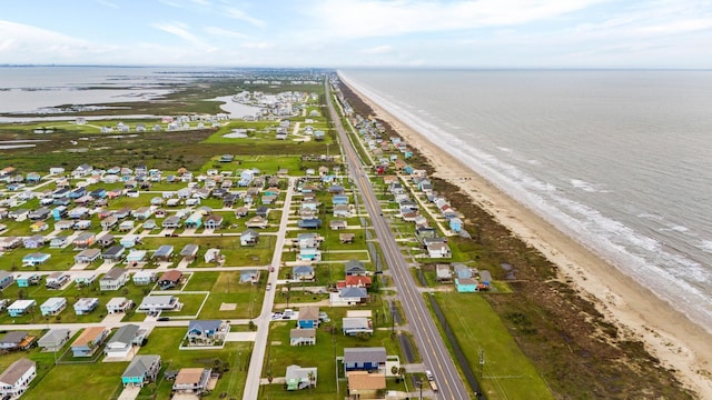 aerial view featuring a water view and a view of the beach