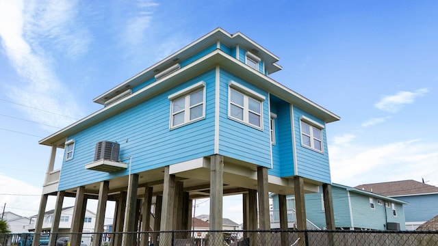 view of side of home with central air condition unit