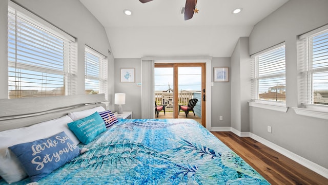 bedroom featuring dark hardwood / wood-style floors, ceiling fan, and lofted ceiling