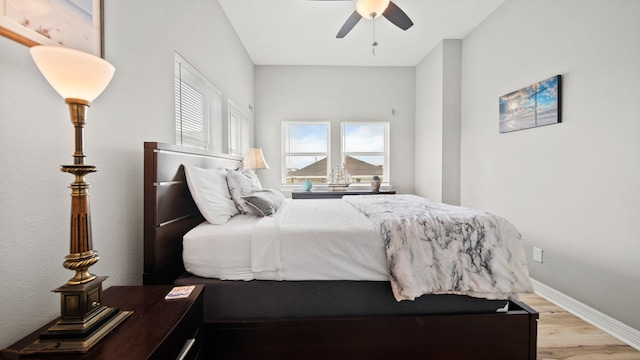 bedroom featuring light hardwood / wood-style flooring and ceiling fan