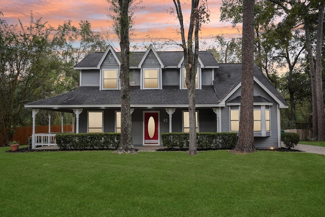 view of front of home featuring a porch and a yard