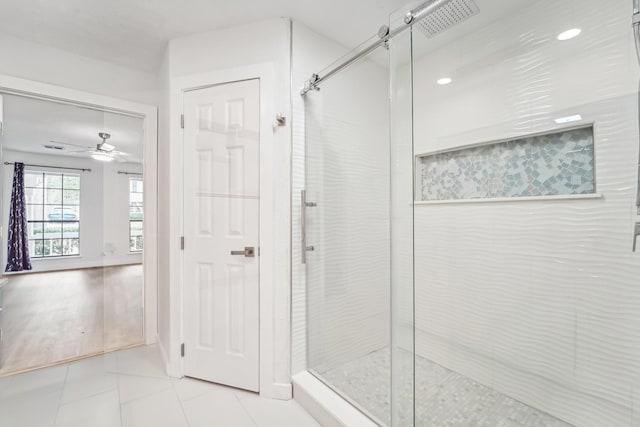 bathroom with an enclosed shower, wood-type flooring, and ceiling fan