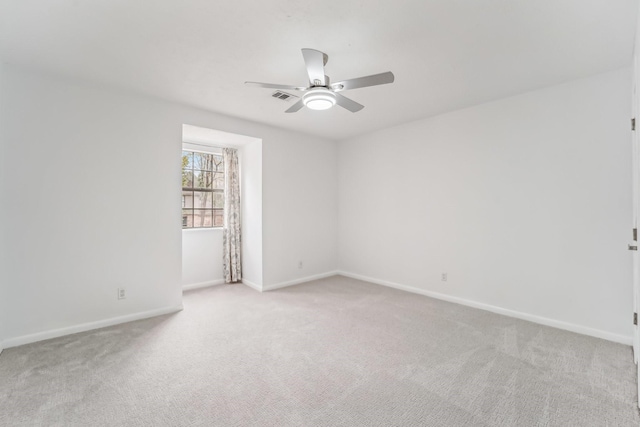 carpeted empty room with ceiling fan