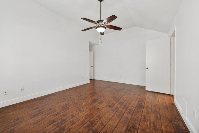 spare room with ceiling fan, dark hardwood / wood-style flooring, and vaulted ceiling