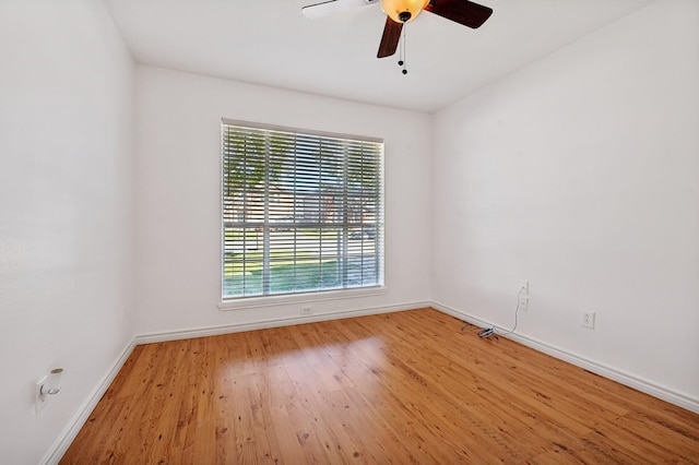 spare room featuring ceiling fan and light hardwood / wood-style floors