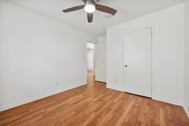 unfurnished bedroom with ceiling fan and light hardwood / wood-style flooring