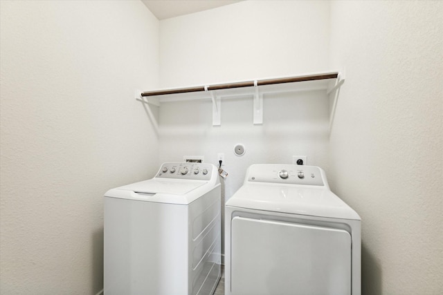 laundry area with washer and clothes dryer