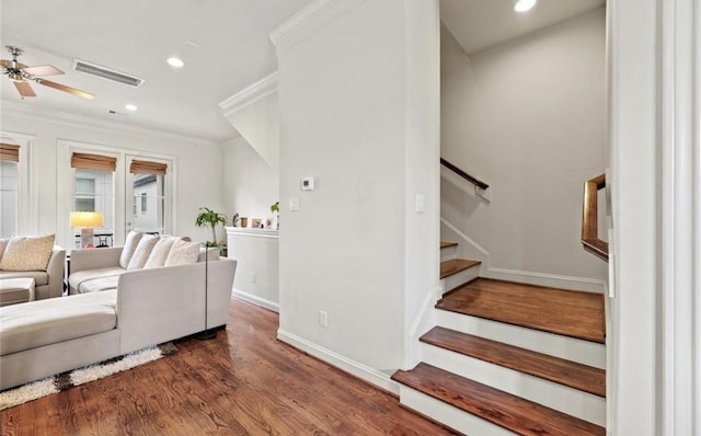 living room with ceiling fan, dark hardwood / wood-style floors, and ornamental molding