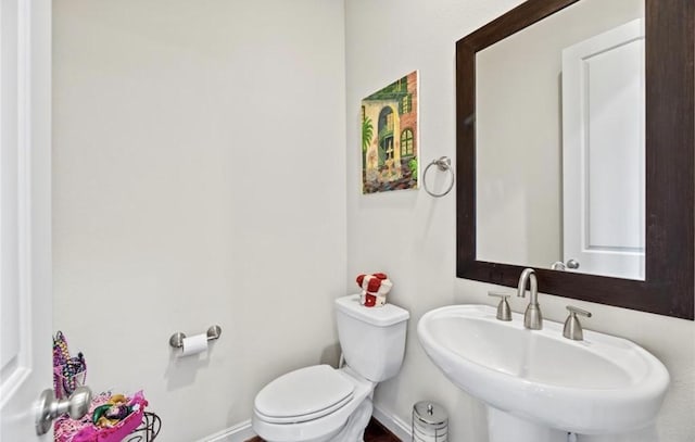 bathroom with toilet and sink