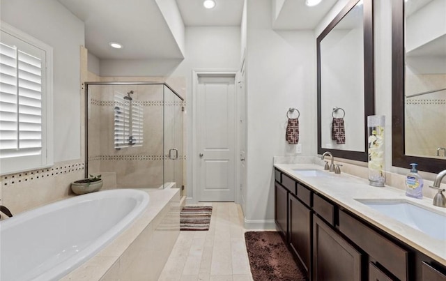 bathroom with vanity and plus walk in shower