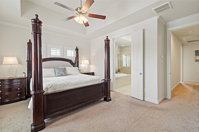 carpeted bedroom with ceiling fan, crown molding, and ensuite bathroom