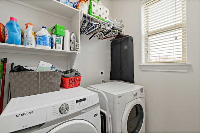 laundry area with washing machine and clothes dryer