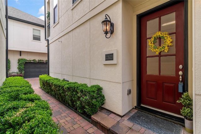 property entrance with a garage