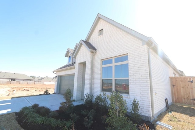 view of side of property featuring a garage