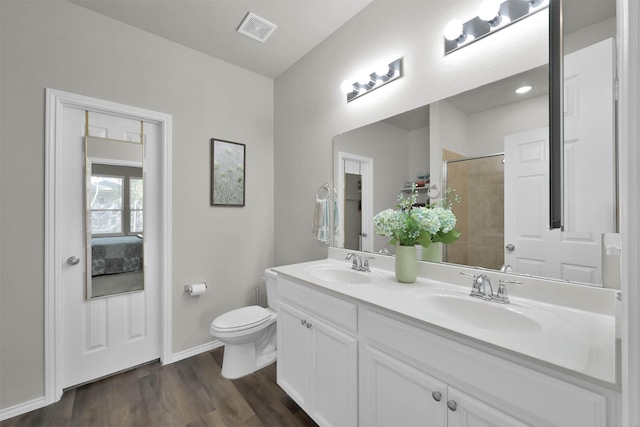 bathroom featuring hardwood / wood-style floors, vanity, and toilet