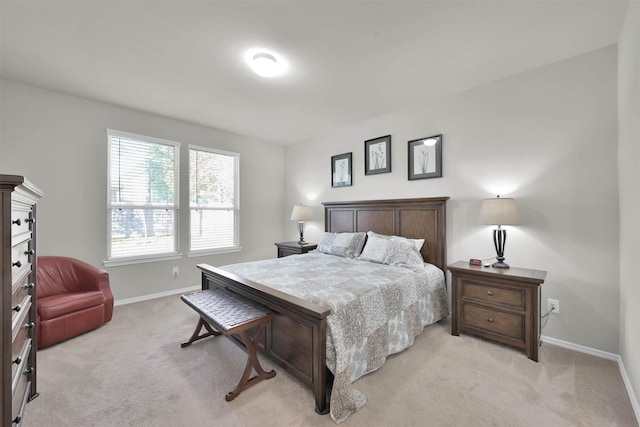 bedroom featuring light colored carpet