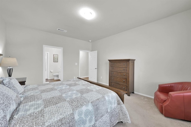 carpeted bedroom with connected bathroom