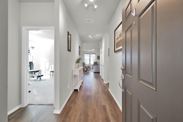 corridor with dark wood-type flooring