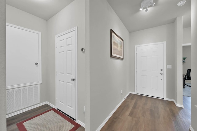 foyer entrance featuring dark hardwood / wood-style flooring