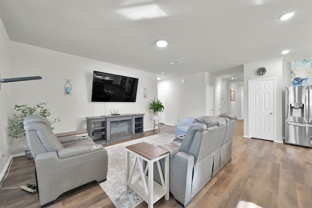 living room with hardwood / wood-style flooring