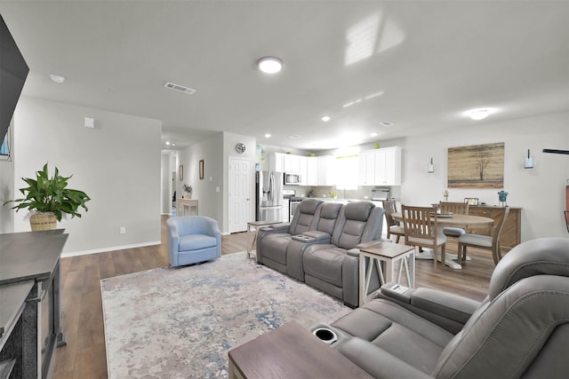 living room featuring dark hardwood / wood-style floors