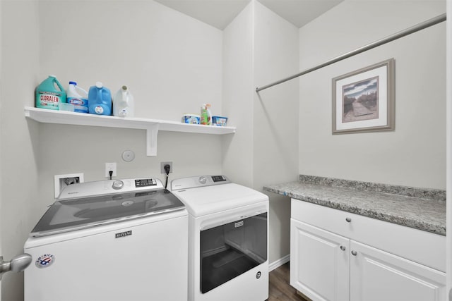 laundry area with separate washer and dryer and dark hardwood / wood-style floors