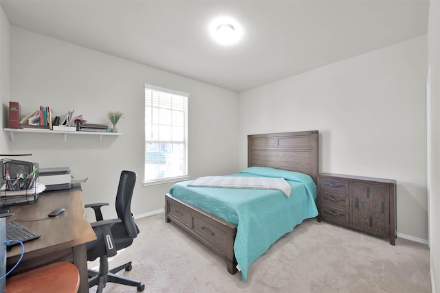 bedroom featuring light carpet