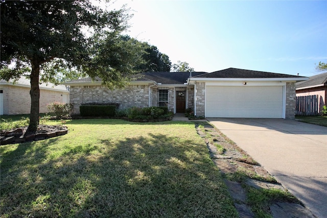 ranch-style home with a front yard and a garage