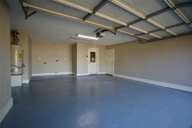 garage featuring gas water heater and a garage door opener