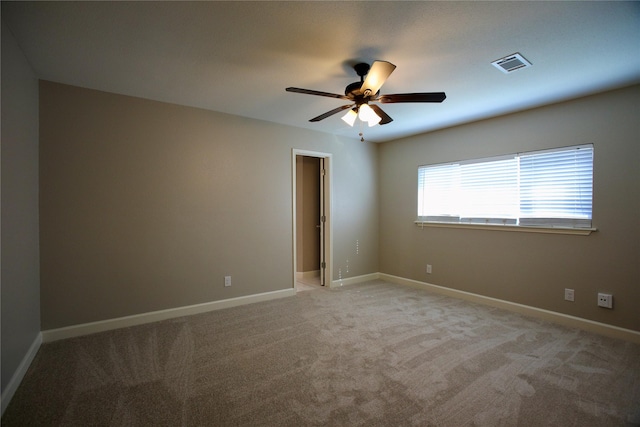 carpeted empty room with ceiling fan