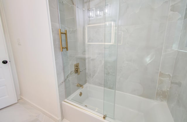 bathroom with tile patterned flooring and shower / bath combination with glass door