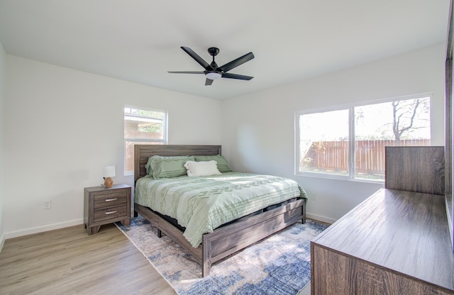 bedroom featuring light hardwood / wood-style flooring and ceiling fan