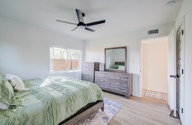 bedroom with ceiling fan and light hardwood / wood-style flooring