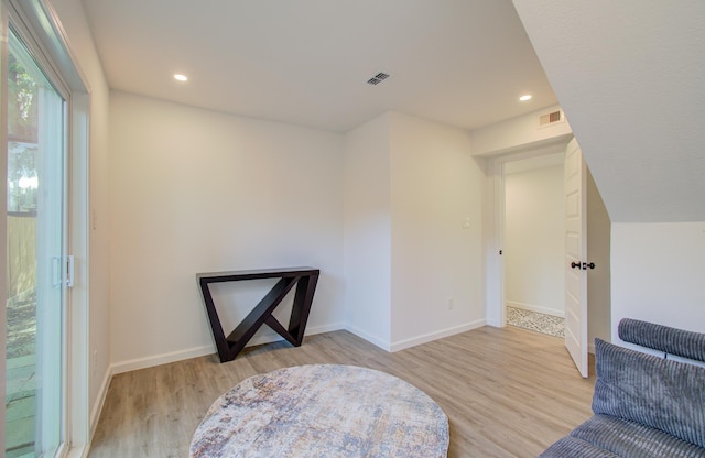 living area with light hardwood / wood-style floors