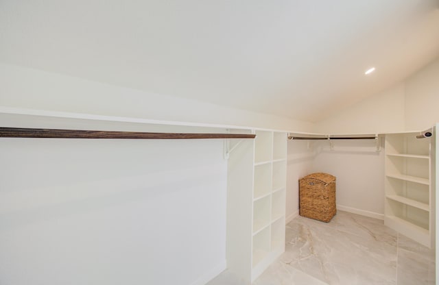 spacious closet with lofted ceiling