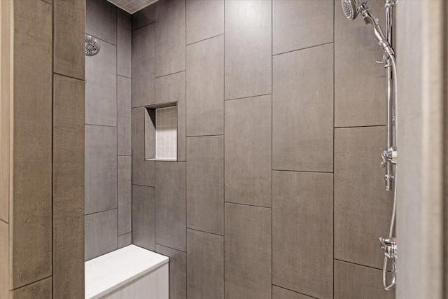 bathroom featuring tiled shower