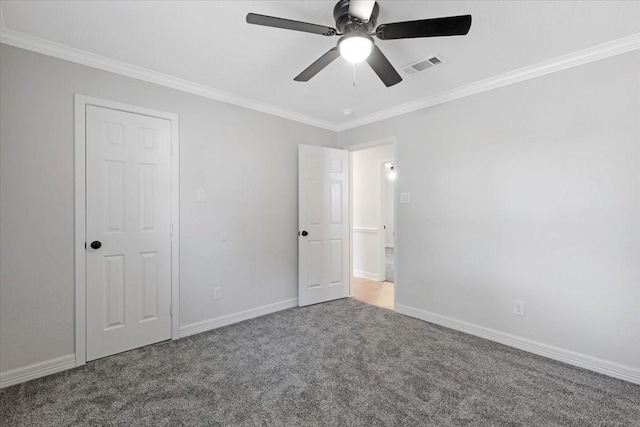 unfurnished bedroom with carpet flooring, ceiling fan, and crown molding