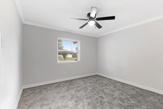 spare room featuring light carpet, ceiling fan, and crown molding