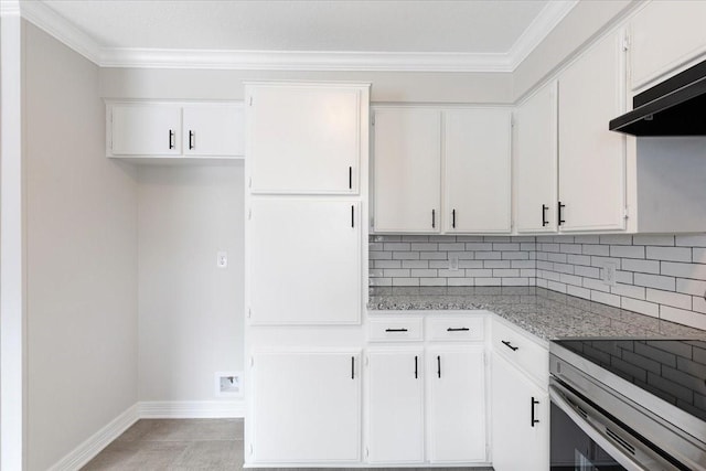 kitchen featuring backsplash, light stone countertops, white cabinets, and range hood