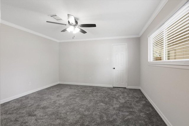 unfurnished room featuring dark carpet, ceiling fan, and crown molding