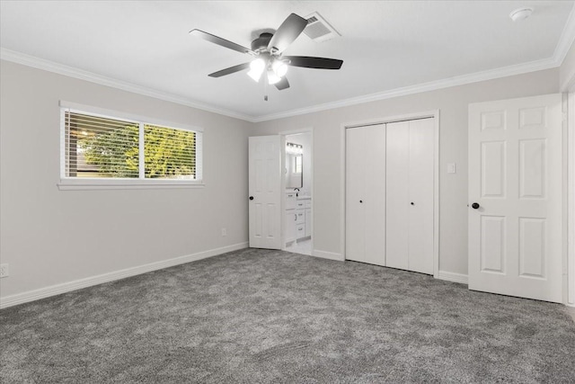 unfurnished bedroom featuring carpet flooring, ceiling fan, ensuite bathroom, and crown molding