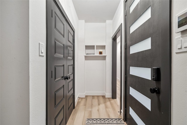 entryway with light hardwood / wood-style flooring