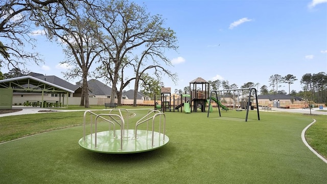 view of community with a playground and a yard