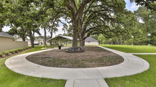 surrounding community featuring a gazebo and a lawn