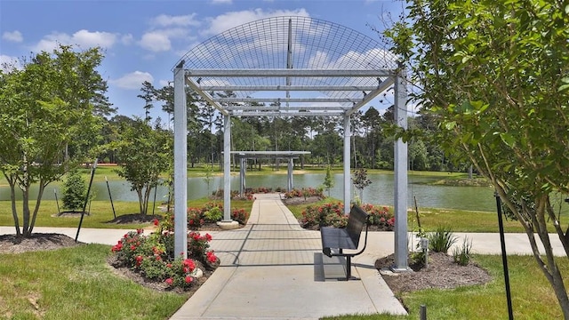 view of patio / terrace featuring a pergola and a water view