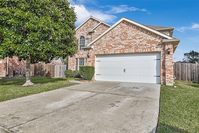 front of property featuring a front lawn and a garage